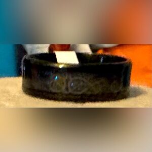 NWOT stainless steal ring w/ blue sparkle inside & black on the outside. Size 11